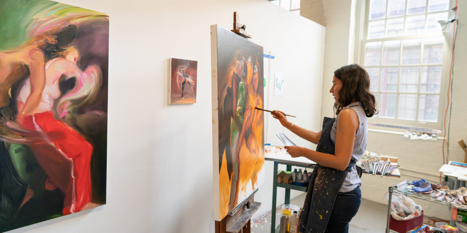 Assets for Artists feature image, woman painting at Easel