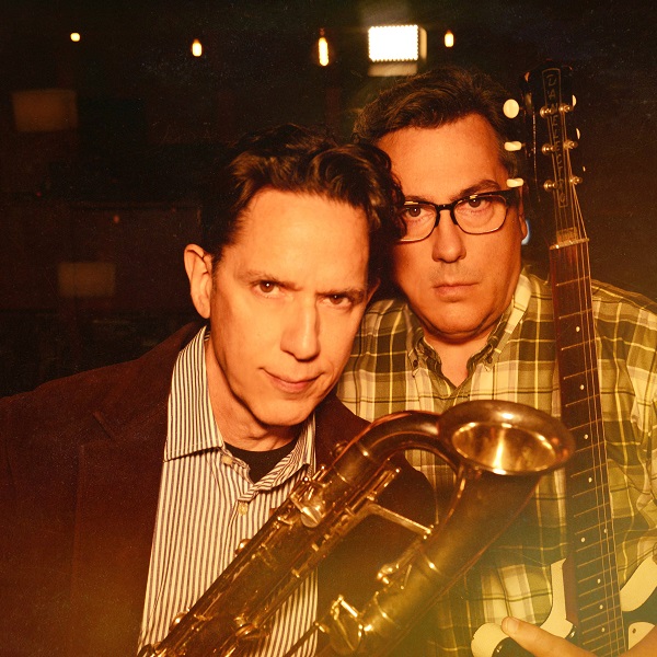 They Might Be Giants holding a tuba and guitar