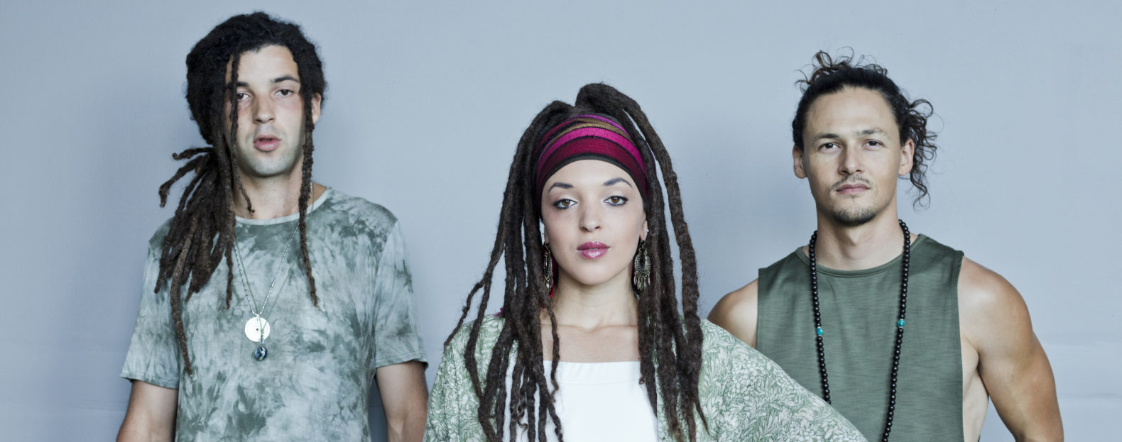 SayReal promo image, three people against a grey background