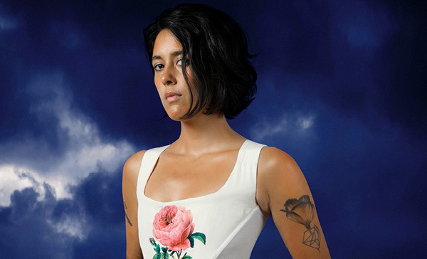 Half Waif album cover, depicting Nadi Rose holding a rose against a purple cloudy sky