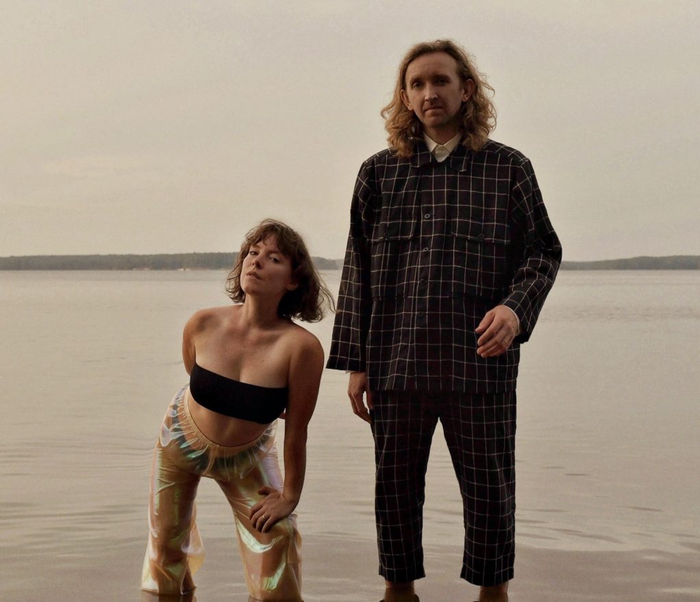 Sylvan Esso standing in a lake