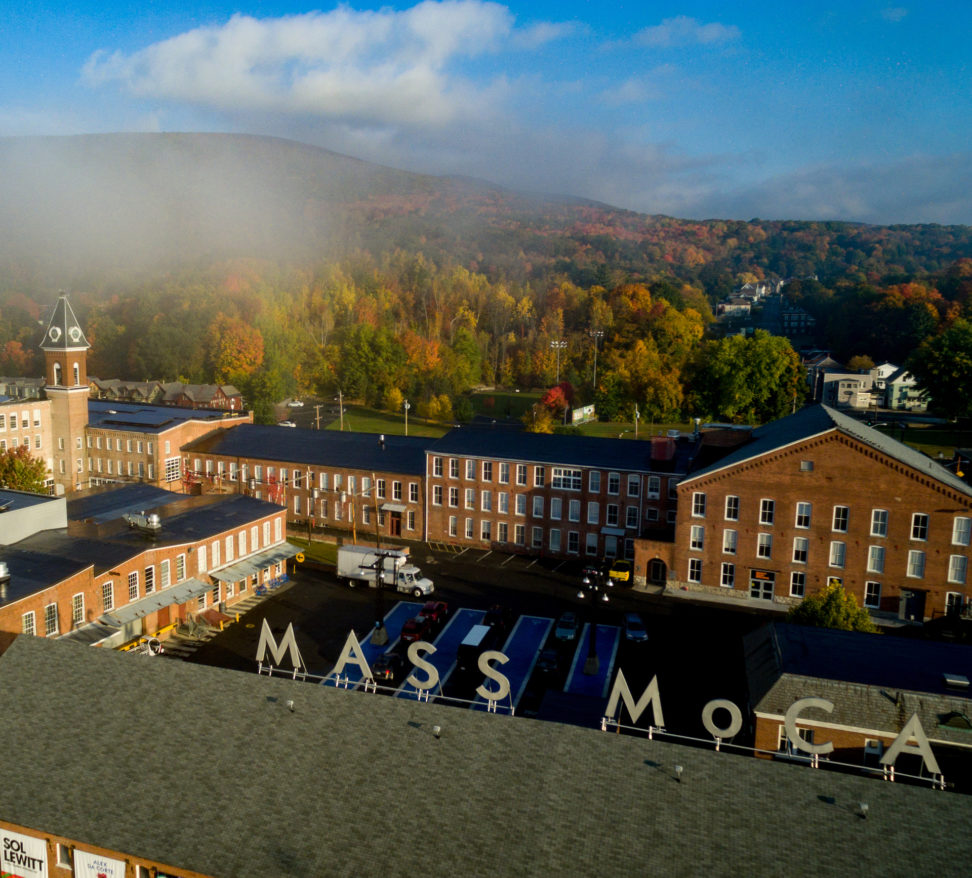 Aerial image of MASS MoCA complex, with MASS MoCA roof sign in foreground