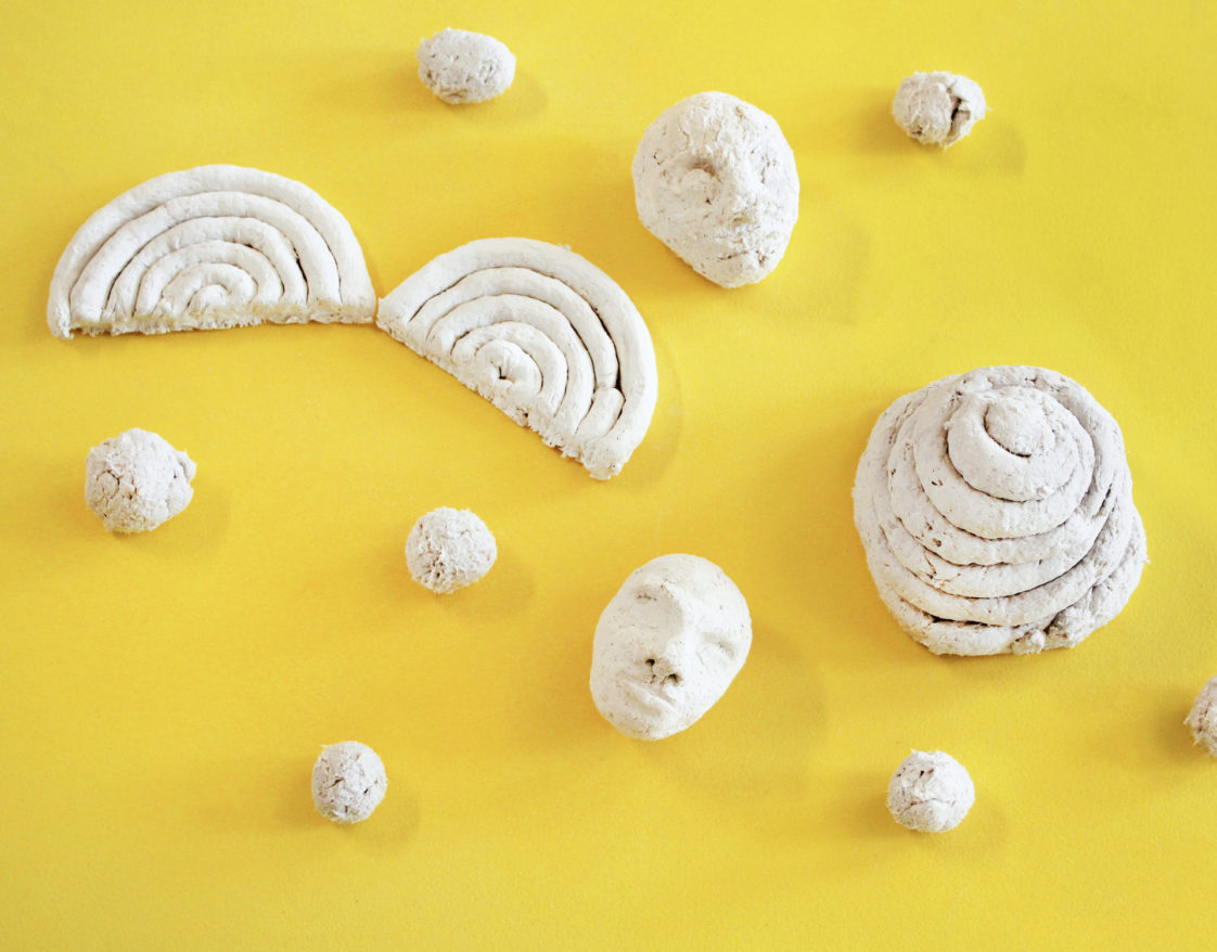 Paper Pulp Clay feature image, paper pulp sculptures against a yellow background