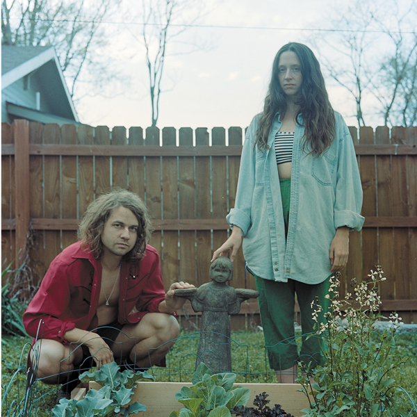 Kevin Morby and Waxahatchee feature image, the two artists standing in a vegetable garden