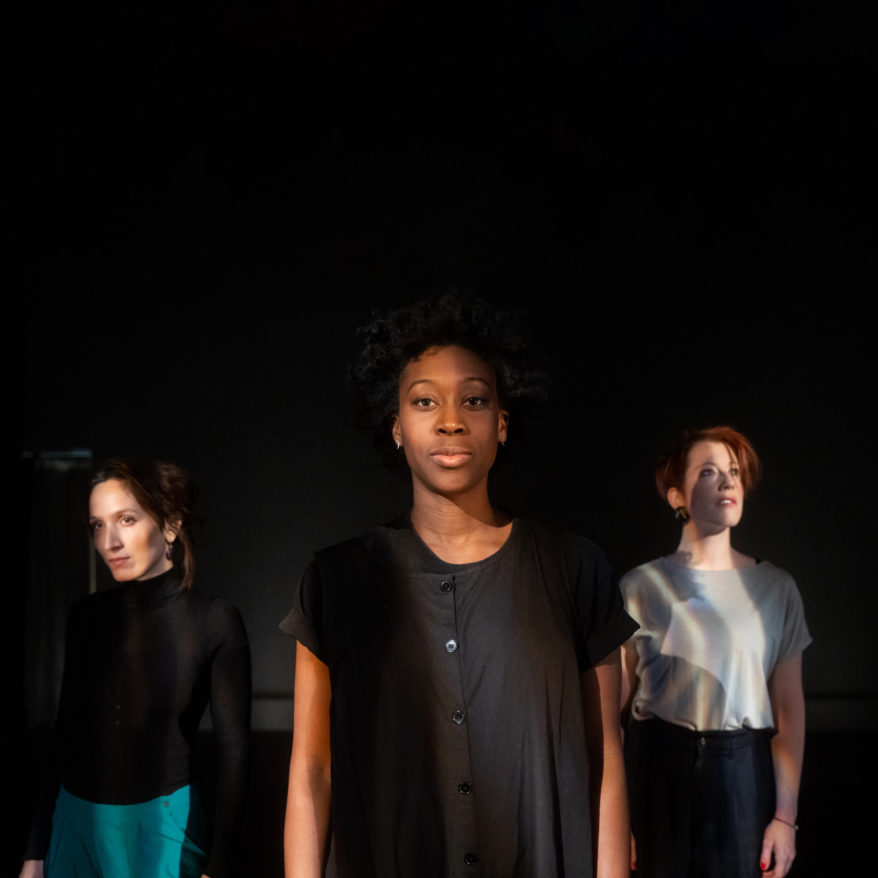 Passion Fruit Dance Company feature image, dance company members standing against black background