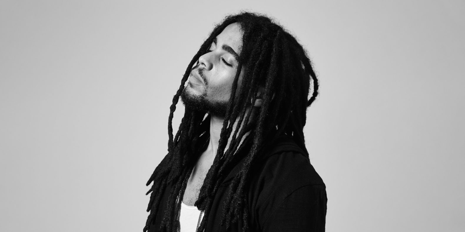 Feature image Skip Marley with Ivy Sole at MASS MoCA, black and white image of Skip Marley with eyes closed