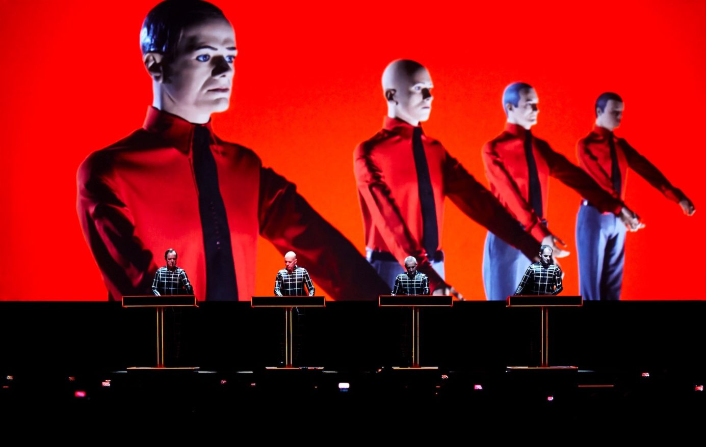 Kraftwerk at MASS MoCA feature image, band members performing on stage in front of red screen