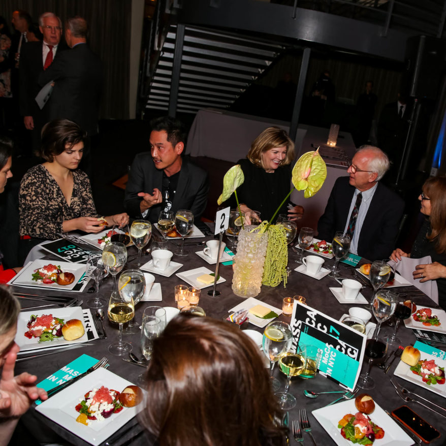 MASS MoCA Gala 2022 feature image, people sitting around a table having lively conversation